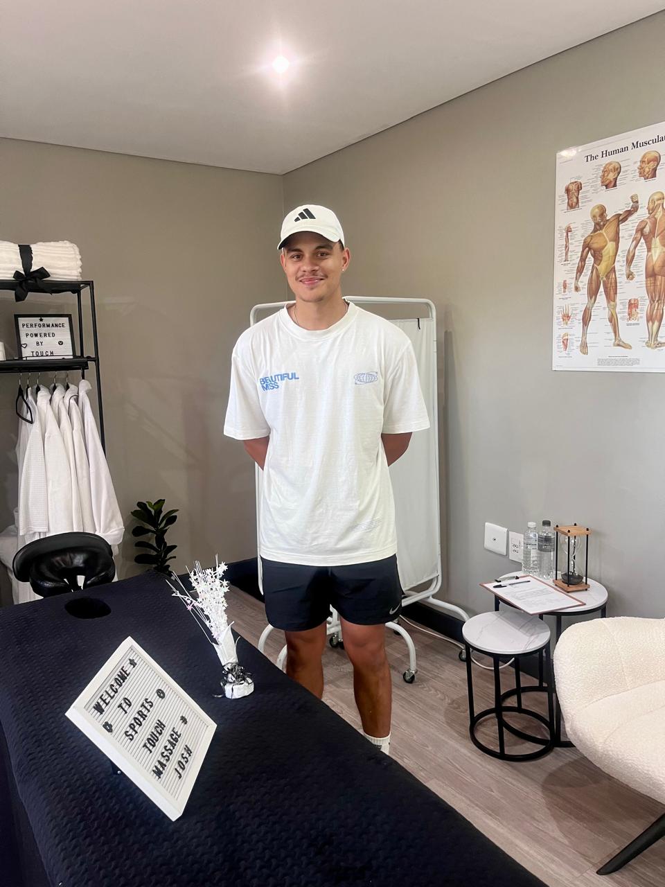 Therapist welcoming clients at Sports Touch Massage